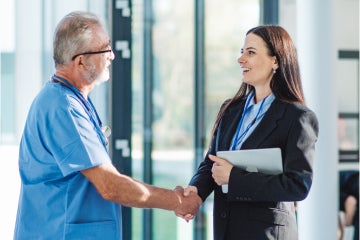man and woman shaking hands