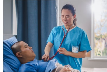 Female nurse checking on patient